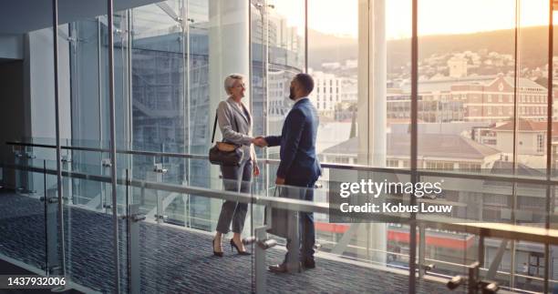 businesspeople, handshake and welcome onboarding during a meeting at the office. b2b professional man and woman greeting for successful deal merger or agreement for a company contract - business respect stock pictures, royalty-free photos & images