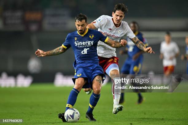 Federico Ceccherini of Hellas Verona competes for the ball with Nicolò Zaniolo of AS Roma during the Serie A match between Hellas Verona and AS Roma...