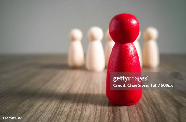 wooden people figures on top of wooden blocks career growth,development and leadership - strategic initiative stock pictures, royalty-free photos & images