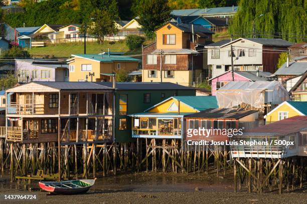 high angle view of houses in town,castro,los lagos,chile - castro chiloé island stock pictures, royalty-free photos & images