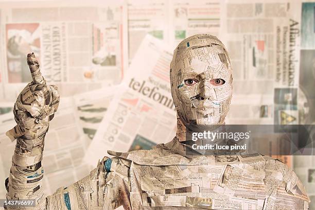 man wrapped in newspaper - con man stockfoto's en -beelden