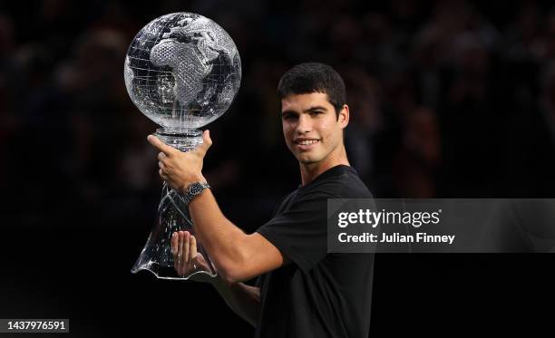 Carlos Alcaraz of Spain receives then poses with the ATP No.1 Trophy during Day One of the Rolex Paris Masters tennis at Palais Omnisports de Bercy...