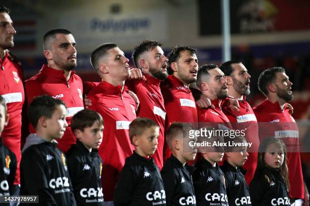 Players of Wales line up for the National Anthems ahead of the Rugby League World Cup 2021 Pool D match between Papua New Guinea and Wales at the...