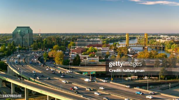 aerial view of interstate 5 passing through downtown sacramento, california - sacramento stock pictures, royalty-free photos & images