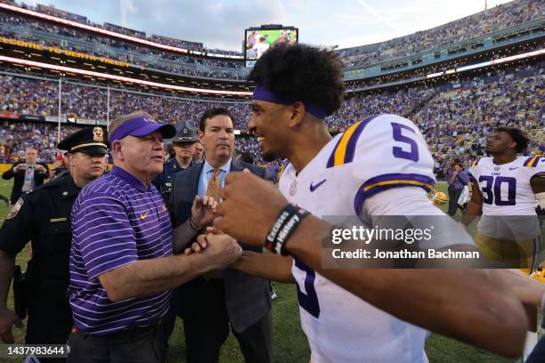 Head coach Brian Kelly of the LSU Tigers and Jayden Daniels celebrate after a game against the Mississippi Rebels at Tiger Stadium on October 22,...