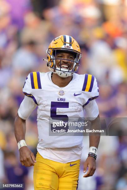 Jayden Daniels of the LSU Tigers celebrates a touchdown during the second half against the Mississippi Rebels at Tiger Stadium on October 22, 2022 in...