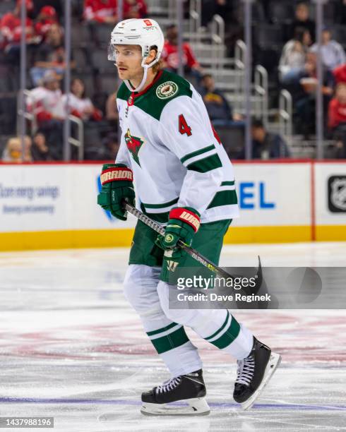 Jon Merrill of the Minnesota Wild follows the play against the Detroit Red Wings during the second period of an NHL game at Little Caesars Arena on...