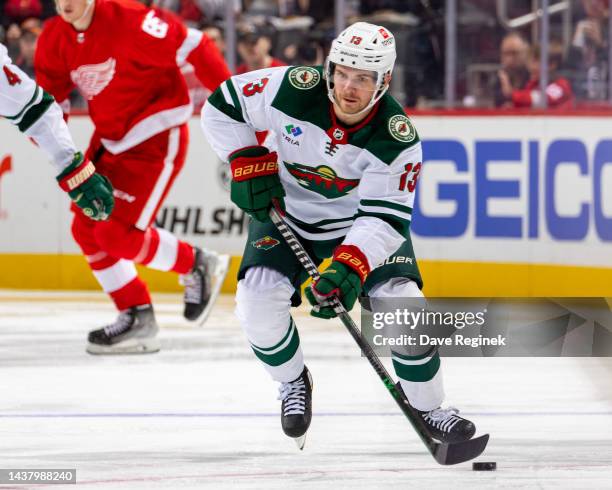 Sam Steel of the Minnesota Wild skates up ice with the puck against the Detroit Red Wings during the second period. Of an NHL game at Little Caesars...