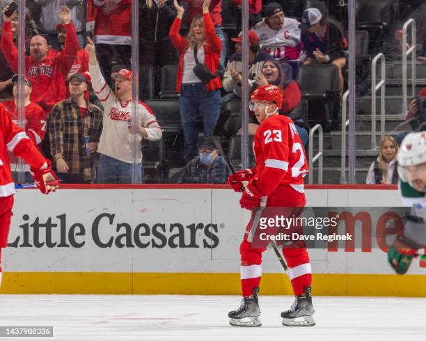 Lucas Raymond of the Detroit Red Wings celebrates a goal against the Minnesota Wild during the third period of an NHL game at Little Caesars Arena on...
