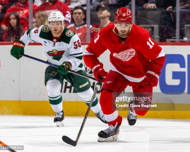 Filip Zadina of the Detroit Red Wings skates up ice against the Minnesota Wild during the first period of an NHL game at Little Caesars Arena on...