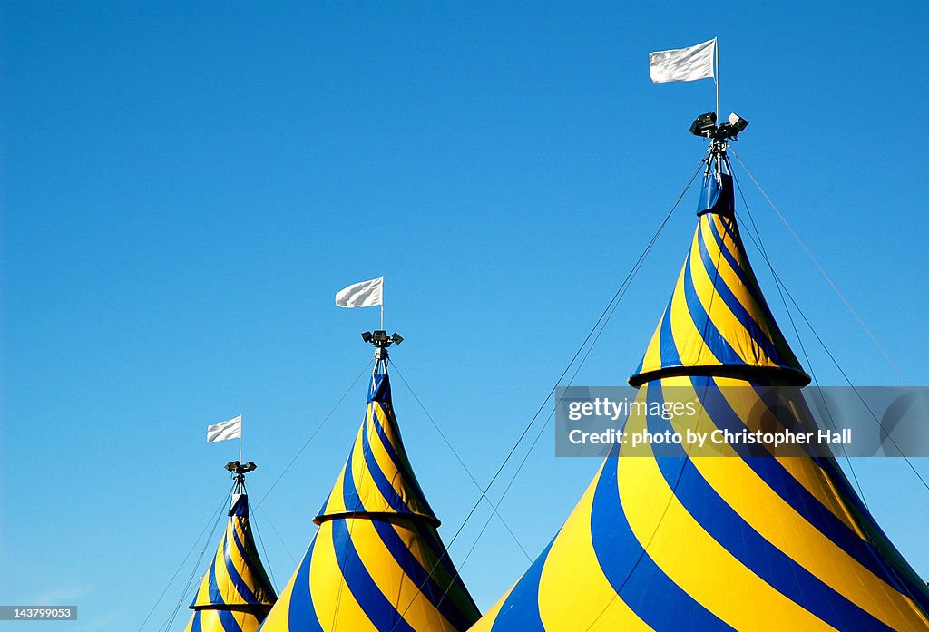 Circus tents against blue sky