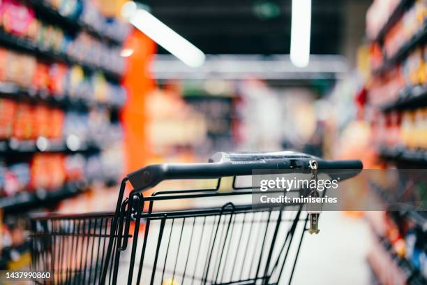 close up of a shopping cart handle - abandoned cart stock pictures, royalty-free photos & images