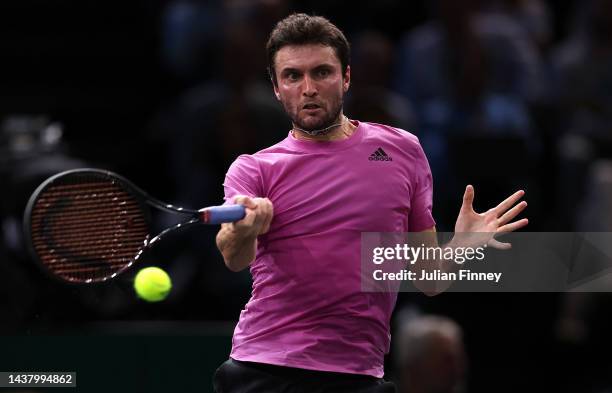 Gilles Simon of France in action against Andy Murray of Great Britain in the first round during Day One of the Rolex Paris Masters tennis at Palais...
