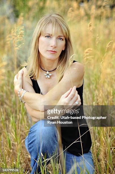 woman in field - tall blonde women stock pictures, royalty-free photos & images