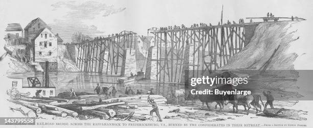 Rebuilding the Railroad Bridge across the Rappahannock burned by retreating Confederates, Rappahannock County, Virginia, early to mid 1860s. From an...