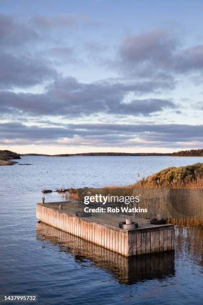 åland archipelago autumn fall stock photo järsö area sea boat jetty pier tranquil - archipelago stock pictures, royalty-free photos & images