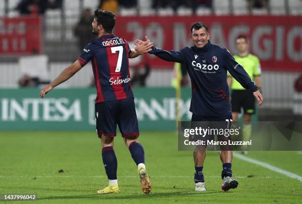 Riccardo Orsolini of Bologna FC celebrates his goal with his team-mate Gary Medel during the Serie A match between AC Monza and Bologna FC at Stadio...