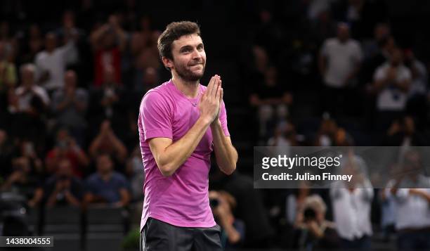 Gilles Simon of France celebrates defeating Andy Murray of Great Britain in the first round during Day One of the Rolex Paris Masters tennis at...
