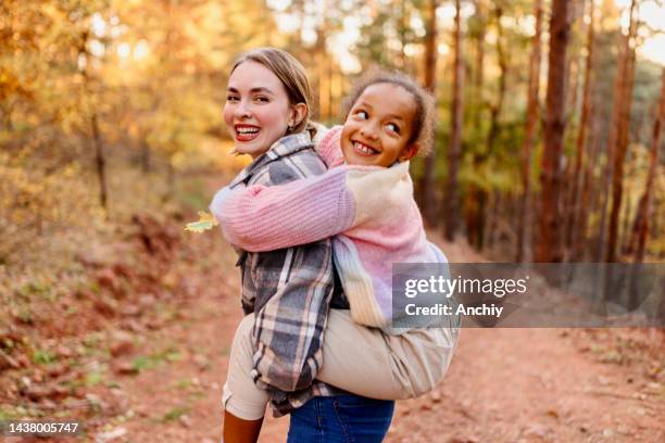 portrait of a mother an daughter - foster stock pictures, royalty-free photos & images