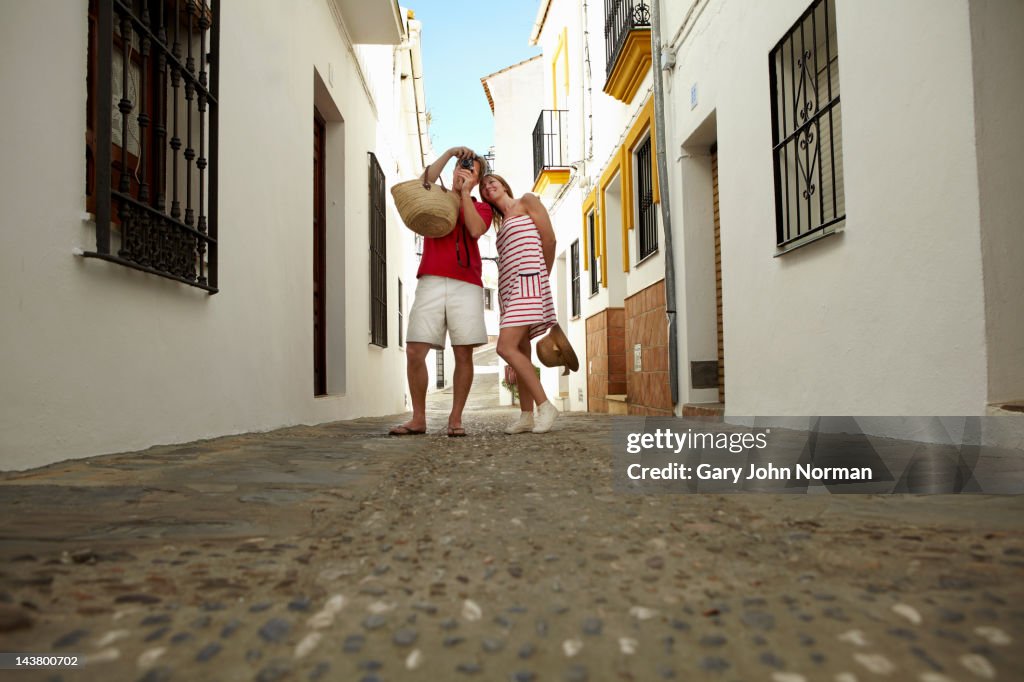 Couple sight seeing in spanish town