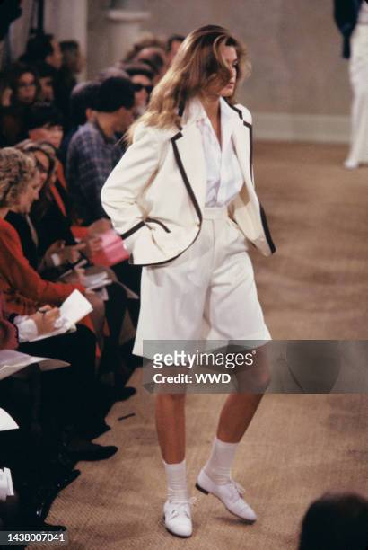 Model wearing a preppy look of long shorts and a blazer from Ralph Lauren's spring/summer 1989 RTW collection on the runway