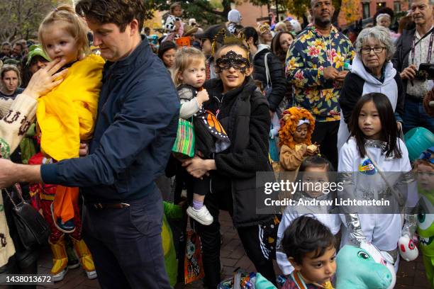 Parents accompany their young children for an early evening celebration of Halloween on October 31, 2022 in the Cobble Hill neighborhood of Brooklyn,...