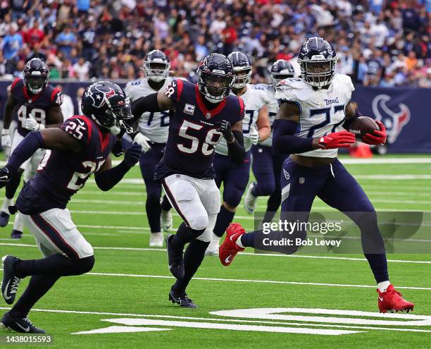 Derrick Henry of the Tennessee Titans runs past Desmond King II of the Houston Texans and Christian Kirksey for a touchdown at NRG Stadium on October...