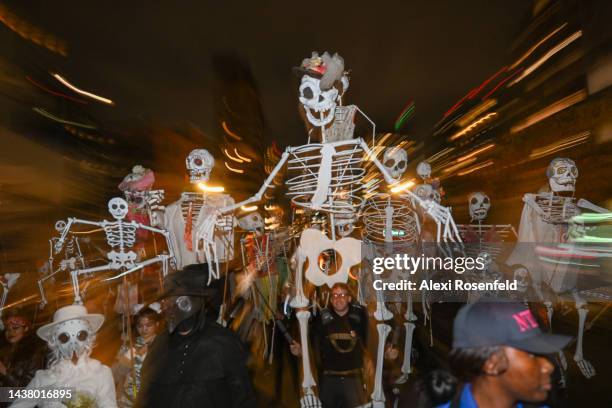 People dressed in costumes participate in New York City’s 49th Annual Village Halloween Parade on October 31, 2022 in New York City. This year’s...