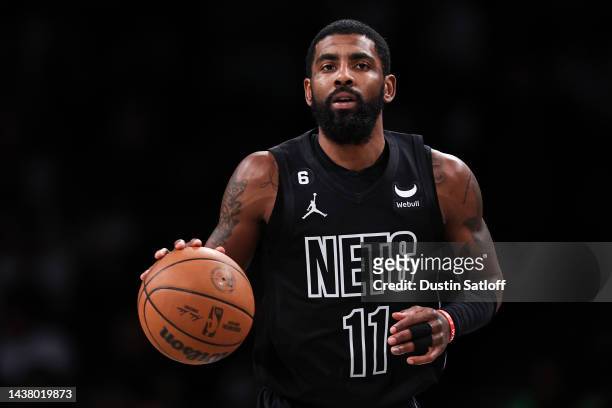 Kyrie Irving of the Brooklyn Nets brings the ball up the court during the first quarter of the game against the Indiana Pacers at Barclays Center on...