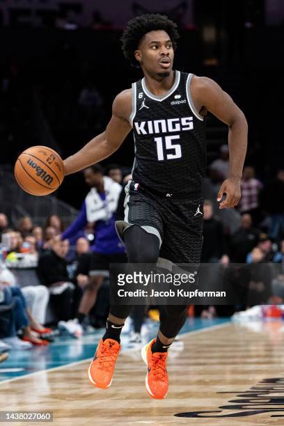 Davion Mitchell of the Sacramento Kings brings the ball up court against the Charlotte Hornets in the fourth quarter during their game at Spectrum...
