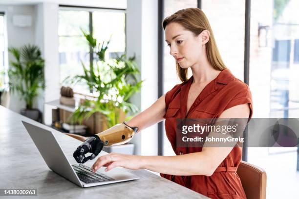 focused young businesswoman working at home - disabilitycollection stock pictures, royalty-free photos & images
