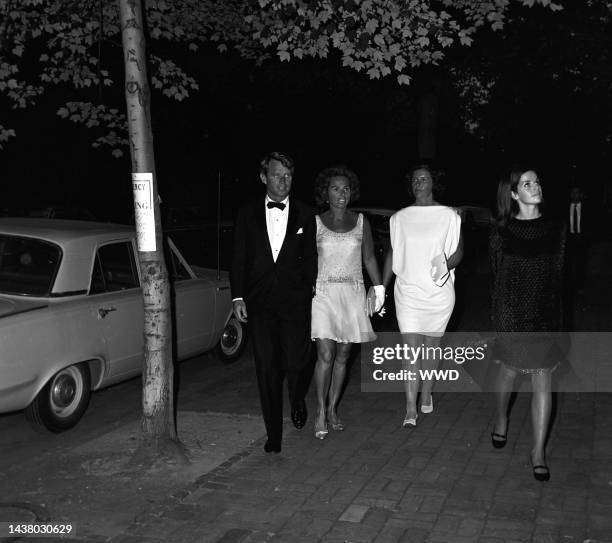 Senator Robert F. And Ethel Kennedy with two unidentified women arriving at the Robert Kennedy anniversary party at Joseph Alsop's home