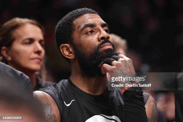 Kyrie Irving of the Brooklyn Nets looks on from the bench during the third quarter of the game against the Indiana Pacers at Barclays Center on...