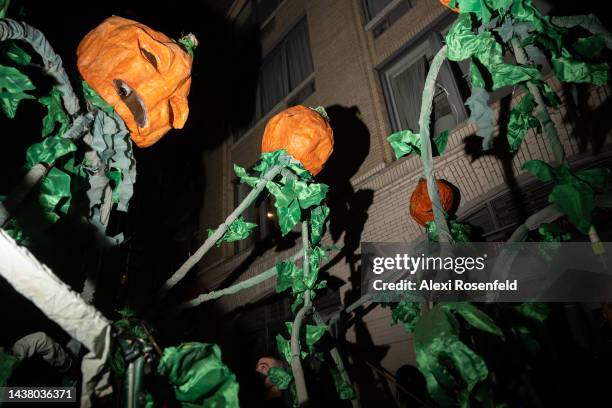 People dressed in pumpkin costumes during New York City’s 49th Annual Village Halloween Parade on October 31, 2022 in New York City. This year’s...