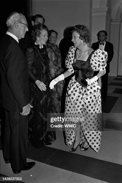Margaret and Dennis Thatcher greeting Brooke Astor at a British Embassy party in Washington for Margaret Thatcher