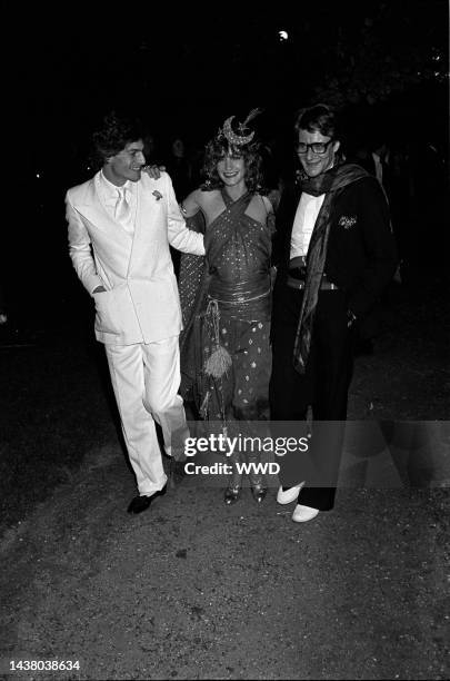 Yves Saint Laurent with Lou Lou de la Falaise and Thadee Klossowski at their wedding reception party in Paris