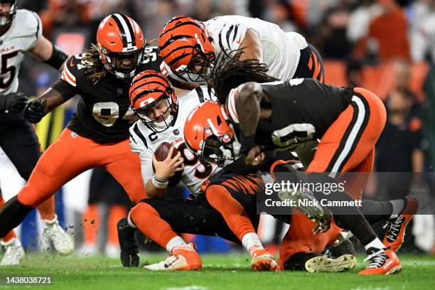 Deion Jones of the Cleveland Browns sacks Joe Burrow of the Cincinnati Bengals during the second half of the game at FirstEnergy Stadium on October...