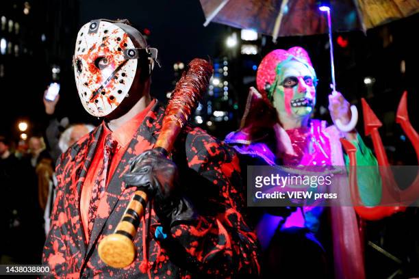 People wearing costumes attend the 49th Annual Halloween parade in Greenwich Village on October 31, 2022 in New York City.
