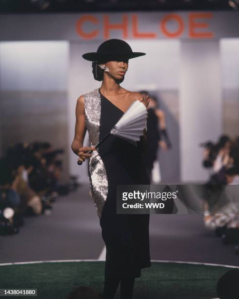 Outtake; Model on the runway of Karl Lagerfeld's Fall 1983 Ready-To-Wear collection for Chloe on March 21, 1983 in Paris, France...Article title:...