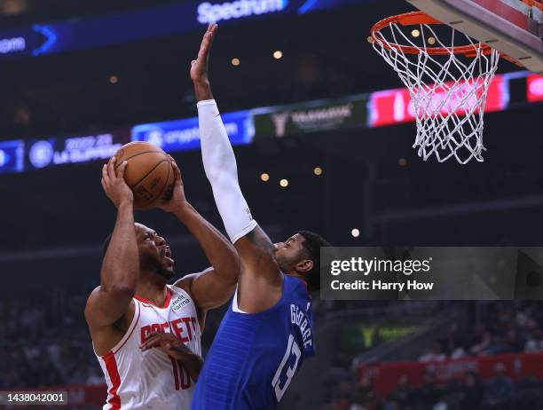 Eric Gordon of the Houston Rockets attempts a shot in front of Paul George of the LA Clippers during the first half at Crypto.com Arena on October...