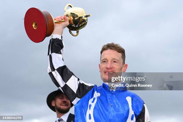 Mark Zahra holds aloft the 2022 Lexus Melbourne Cup after riding Gold Trip to win race seven, the Lexus Melbourne Cup during 2022 Melbourne Cup Day...