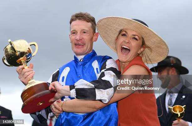 Mark Zahra who rode Gold Trip celebrates with the trophy with his wife Elyse Zahra after winning race seven, the Lexus Melbourne Cup during 2022...