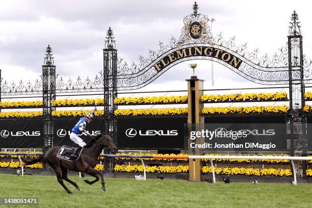 Mark Zahra celebrates when crossing the finish line after riding Gold Trip to win race 7 the Lexus Melbourne Cup during 2022 Melbourne Cup Day at...