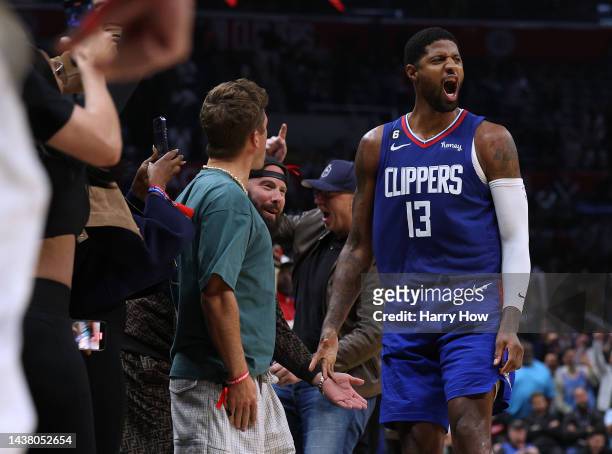Paul George of the LA Clippers celebrates his shot along the sidelines, to take a 95-93 lead over the Houston Rockets during the fourth quarter in a...