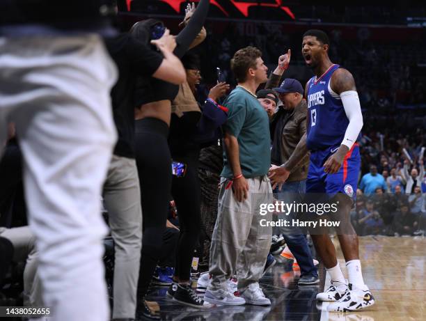 Paul George of the LA Clippers celebrates his shot along the sidelines, to take a 95-93 lead over the Houston Rockets during the fourth quarter in a...