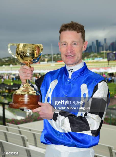 Mark Zahra poses with the Melbourne Cup after riding Gold Trip to win Race 7, the Lexus Melbourne Cup, during 2022 Lexus Melbourne Cup Day at...