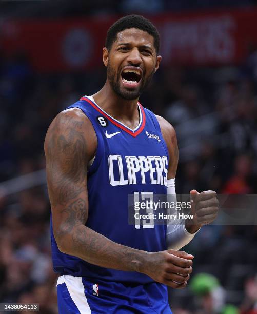 Paul George of the LA Clippers celebrates his basket as he calls for a foul during the second half in a 95-93 Clipper win over the Houston Rockets at...