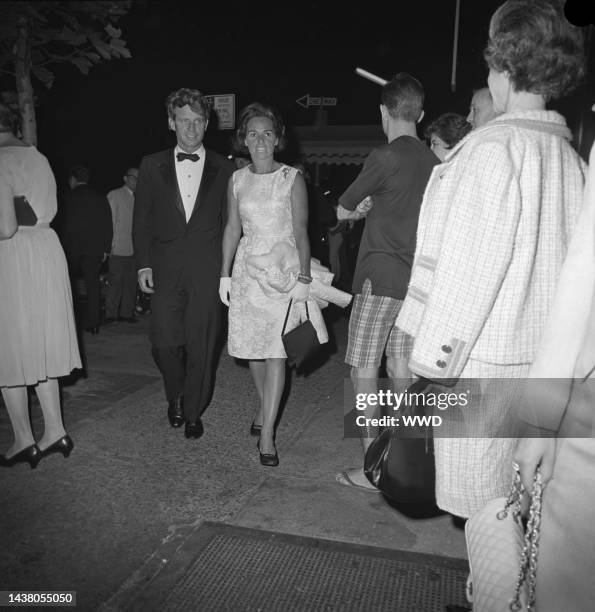 Robert and Ethel Kennedy arriving at an event at the Asia House hosted by Jacqueline Kennedy for John K. Galbraith in New York