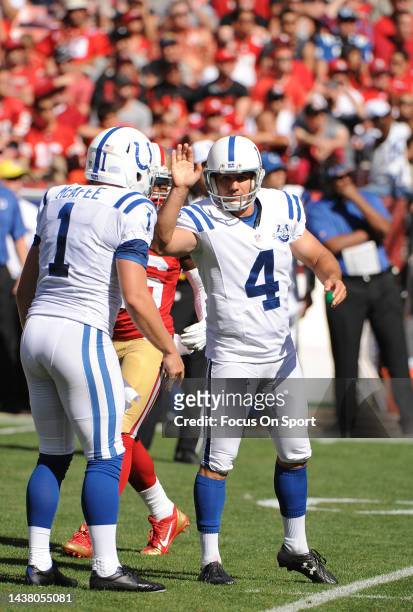 Adam Vinatieri and Pat McAfee of the Indianapolis Colt celebrates after Vinatieri kicked a field goal against the San Francisco 49ers during an NFL...