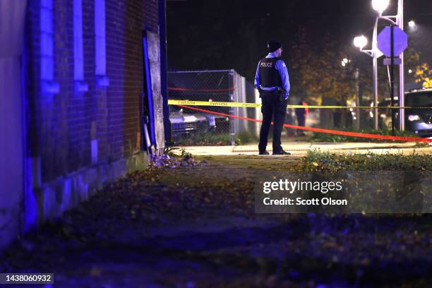 Police investigate the scene where as many as 14 people were reported to have been shot on October 31, 2022 in Chicago, Illinois. Three juveniles...